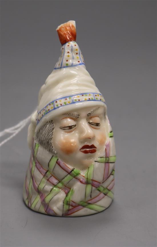 A Royal Worcester candle extinguisher of a man in a bed cap